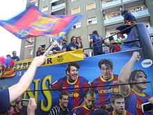 Messi e seus companheiros de equipe celebrando o título da Liga dos Campeões, em Barcelona Imagoi