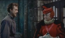 Em cena Richard Todd, como Sir Walter Raleigh, e Bette Davis como Elizabeth I.